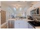 View from kitchen into living area with an open floorplan and skylights at 12321 Sun Vista W Ct # 52, Treasure Island, FL 33706