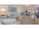 Comfortable living space with open floor plan and view into dining and kitchen areas at 12321 Sun Vista W Ct # 52, Treasure Island, FL 33706