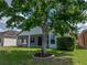 Lush backyard featuring a mature tree providing shade and beauty to the outdoor space at 12713 Whitney Meadow Way, Riverview, FL 33578