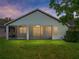 Well maintained backyard with green grass and a screened lanai, perfect for outdoor enjoyment at 12713 Whitney Meadow Way, Riverview, FL 33578