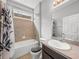 Cozy bathroom features a shower-tub combination and vanity with sink at 12713 Whitney Meadow Way, Riverview, FL 33578