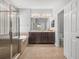 Bathroom featuring a glass shower, soaking tub, double vanity, and a tile floor at 12713 Whitney Meadow Way, Riverview, FL 33578