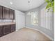 Breakfast nook featuring neutral paint, tile floors, closet, and a window at 12713 Whitney Meadow Way, Riverview, FL 33578