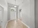 Entryway featuring tile floors, a pendant light, and a white front door at 12713 Whitney Meadow Way, Riverview, FL 33578