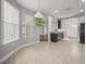 Kitchen and dining room with stainless steel appliances and neutral countertops at 12713 Whitney Meadow Way, Riverview, FL 33578