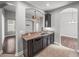 Kitchen featuring a stainless steel sink, appliances, and a breakfast bar with views of the living area at 12713 Whitney Meadow Way, Riverview, FL 33578
