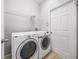 This is a laundry room with a washer and dryer at 12713 Whitney Meadow Way, Riverview, FL 33578