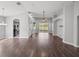Spacious living room with wood floors, vaulted ceilings, and lots of natural light at 12713 Whitney Meadow Way, Riverview, FL 33578