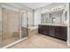 Main bathroom featuring a walk-in shower, soaking tub, and vanity area at 12713 Whitney Meadow Way, Riverview, FL 33578