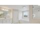 Modern bathroom showcasing a soaking tub, shower, and stylish vanity with ample counter space at 13137 Wellspring Dr, Lithia, FL 33547