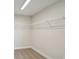 Walk-in closet with carpet flooring and wire shelving for maximum storage and organization at 13137 Wellspring Dr, Lithia, FL 33547