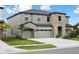 Stunning two-story home with stone accents, a three-car garage, and well-manicured landscaping at 13137 Wellspring Dr, Lithia, FL 33547