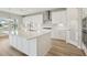 Bright kitchen with large island, stainless steel appliances, and modern white cabinets at 13137 Wellspring Dr, Lithia, FL 33547