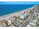 Stunning aerial view of the building near the beach with turquoise water at 13440 Gulf Blvd # 501, Madeira Beach, FL 33708