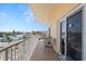 Spacious balcony with seating, offering views of the city and surrounding landscape at 13440 Gulf Blvd # 501, Madeira Beach, FL 33708