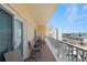 Enjoy this spacious balcony with chairs and views of the city and ocean at 13440 Gulf Blvd # 501, Madeira Beach, FL 33708