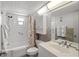 Clean, well-lit bathroom with a shower-tub combination and neutral-toned finishes at 13440 Gulf Blvd # 501, Madeira Beach, FL 33708