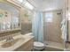Clean and well-lit bathroom with a walk-in shower, neutral finishes, and a modern sink at 13440 Gulf Blvd # 501, Madeira Beach, FL 33708