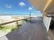 Easy beach access featuring a wooden walkway that includes an outdoor shower at 13440 Gulf Blvd # 501, Madeira Beach, FL 33708