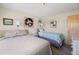 Comfortable bedroom featuring two beds, tasteful decor, and natural lighting at 13440 Gulf Blvd # 501, Madeira Beach, FL 33708
