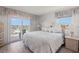 Inviting bedroom with access to a balcony offering scenic city views and comfortable decor at 13440 Gulf Blvd # 501, Madeira Beach, FL 33708