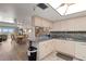 Open kitchen with an island counter, flowing into dining and living area at 13440 Gulf Blvd # 501, Madeira Beach, FL 33708