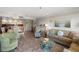 Open living and dining area with comfortable seating and wood-look flooring at 13440 Gulf Blvd # 501, Madeira Beach, FL 33708