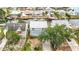 Waterfront home with a white roof features multiple balconies and private boat dockage along a navigable canal at 13918 Raie Ave, Hudson, FL 34667