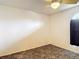 Spare bedroom features a ceiling fan, durable flooring, and a window for natural light at 13918 Raie Ave, Hudson, FL 34667