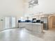 Large, modern kitchen with sleek island, stainless steel appliances, and tile flooring for easy cleanup at 13918 Raie Ave, Hudson, FL 34667