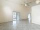 Open living room with lots of natural light from sliding doors to the outside at 13918 Raie Ave, Hudson, FL 34667