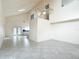 Spacious living room has an open concept floor plan with tile flooring and high ceilings at 13918 Raie Ave, Hudson, FL 34667