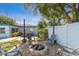 Cozy backyard fire pit area with string lights and patio at 1503 4Th St Sw, Largo, FL 33770