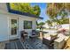 Outdoor seating area with a view of the pool and a well-maintained yard at 1503 4Th St Sw, Largo, FL 33770