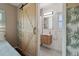 Ensuite bathroom with decorative tile, updated fixtures, and a modern barn door at 1503 4Th St Sw, Largo, FL 33770