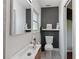 Powder room with an updated sink, toilet, and fixtures, and a quirky design at 1503 4Th St Sw, Largo, FL 33770
