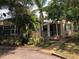 Charming home features a covered front porch and lush, mature landscaping at 1508 S Clark Ave, Tampa, FL 33629
