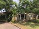 This single-story home boasts a covered front porch, mature landscaping, and a cozy curb appeal at 1508 S Clark Ave, Tampa, FL 33629