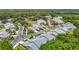 A tranquil community with manicured lawns, lush trees, and palm-lined streets create a welcoming atmosphere for residents at 1628 Lullwater Ln, Lutz, FL 33549