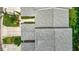 Drone image of a well maintained roof on a lovely home with mature trees and landscaping at 1628 Lullwater Ln, Lutz, FL 33549