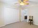 Bedroom including a view into the office, and a large closet at 1628 Lullwater Ln, Lutz, FL 33549