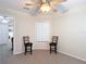 Bonus room with neutral carpet and fan, plus an adjacent room beyond a doorway at 1628 Lullwater Ln, Lutz, FL 33549