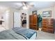 Bedroom featuring wood look flooring and view into another room at 1628 Lullwater Ln, Lutz, FL 33549