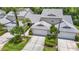 Inviting two-story townhouse with attached garage and attractive landscaping at 1628 Lullwater Ln, Lutz, FL 33549