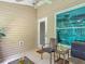 Charming patio with comfortable seating, neutral siding, and a lovely view of the outdoor space at 1628 Lullwater Ln, Lutz, FL 33549