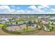 Aerial view of a neighborhood playground and the community surrounding it at 16892 Delia St, Wimauma, FL 33598