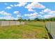Expansive backyard with a white vinyl fence at 16892 Delia St, Wimauma, FL 33598