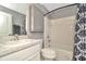 Well-lit bathroom featuring a vanity with granite countertop, updated fixtures, and a shower-tub combination at 16892 Delia St, Wimauma, FL 33598
