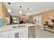 Open floorplan kitchen view into the living area at 16892 Delia St, Wimauma, FL 33598