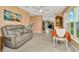 Open-concept living and dining area with view into the kitchen at 16892 Delia St, Wimauma, FL 33598